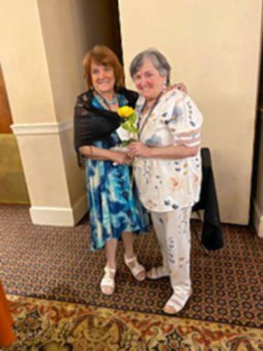 Carolyn Pollard encourages her sister, Linda Gonyer, to become an honored KOPS. Once a TOPS participant loses the weight recommended by her or his physician, they are considered “KOPS,” which stands for Keeping Off Pounds Sensibly.