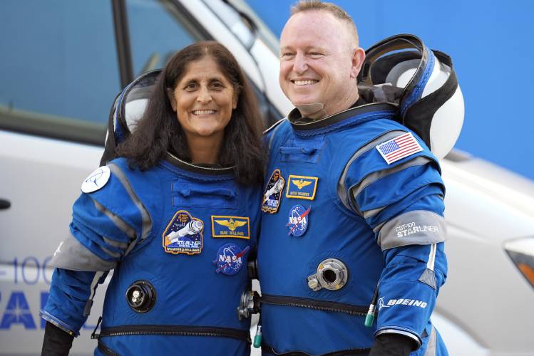 NASA astronauts Sunita “Suni” Williams, left, and Barry “Butch” Wilmore stand together for a photo enroute to the launch pad at Space Launch Complex 41 in Cape Canaveral, Fla., on June 5 for their liftoff on the Boeing Starliner Calypso capsule to the International Space Station. What was supposed to be an eight-day trip will last closer to eight months due to technical issues with the Starliner.