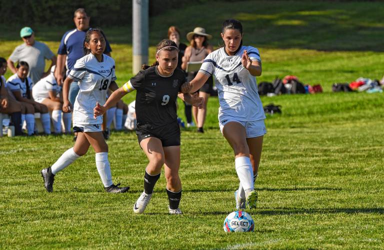 Pioneer’s Dani Teaca (9), left, battles for possession with Franklin Tech’s Laken Woodard (14) during the teams’ 0-0 tie in season-opening Bi-County League action on Wednesday in Northfield.