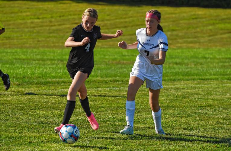 Pioneer’s Ahnna Berthiaume (4), left, dribbles while defended by Franklin Tech’s Layla Hammond (7) during the teams’ 0-0 tie in season-opening Bi-County League action on Wednesday in Northfield.