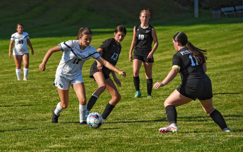 Franklin Tech’s Alyssa Peters (17), left, dribbles while defended by Pioneer’s Charley Harrington (13) and Leah Potter (11) during the teams’ 0-0 tie in season-opening Bi-County League action on Wednesday in Northfield.