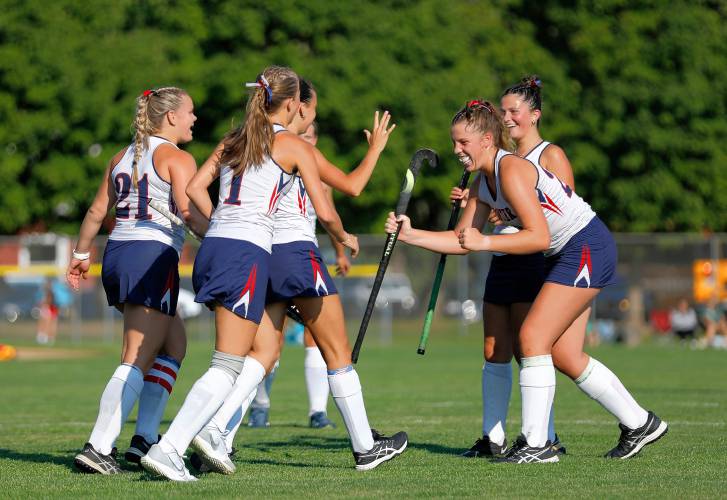 Frontier players celebrate a goal in the third quarter against Greenfield on Wednesday in South Deerfield.