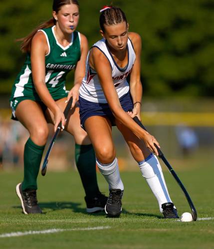 Frontier’s Rowan Reilly (3) carries the ball under pressure from Greenfield’s Carson Farrell (14) in the fourth quarter Wednesday in South Deerfield.