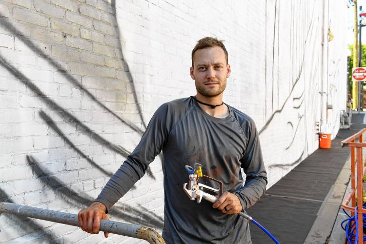 Muralist Darion Fleming of Charlotte, North Carolina, has started working on his mural on the side of the Shea Theater Arts Center in Turners Falls.