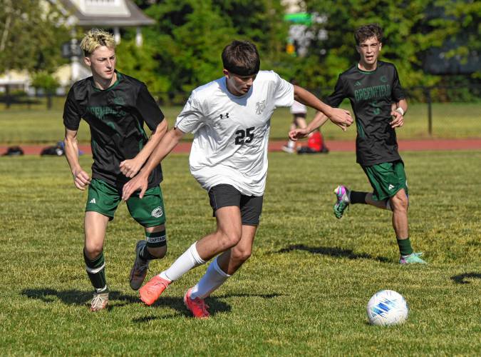 Pioneer’s William Glazier (25) carries the ball against Greenfield during the teams’ 1-1 tie in Schmid Division opening action on Thursday in Greenfield.