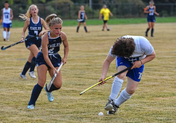 Franklin Tech’s Abi Dobias (2), left, pursues the ball against Turners Falls’ Patrick Andrews during field hockey action in Turners Falls on Friday.