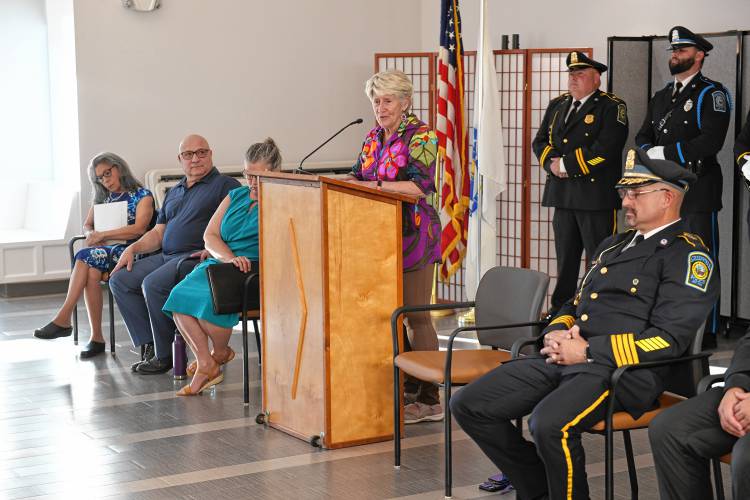 Greenfield Mayor Ginny Desorgher lauds Todd Dodge just before he was sworn in as Greenfield’s permanent police chief at the John Zon Community Center on Tuesday evening.