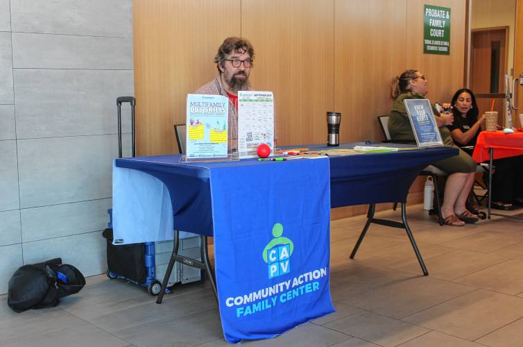 David Cole, school liaison at the Community Action Family Center, set up a table at the Community Resource Center at the Franklin County Justice Center on Thursday to explain how he works with children who require court-mandated assistance.