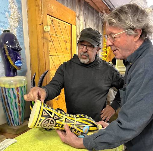 Cape Cod multimedia artist Carl Lopes and Heath glassblower Robert Dane collaborating on a piece for the “Heartbeats and Harmony” exhibit.