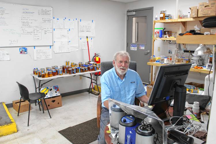 Biodiesel Operations Manager Brian Clark sits before fuel samples at his Silvio O. Conte Drive site in Greenfield before selling the start-up.