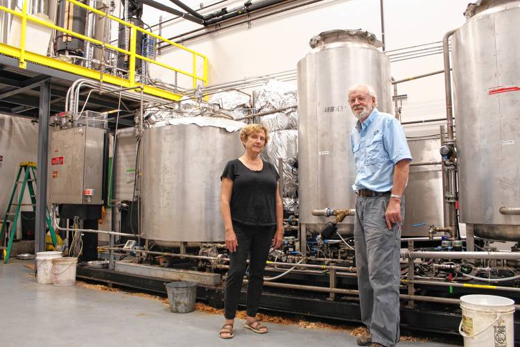 Northeast Biodiesel President Lynn Benander and Biodiesel Operations Manager Brian Clark walk around their Silvio O. Conte Drive site in Greenfield before selling the start-up.