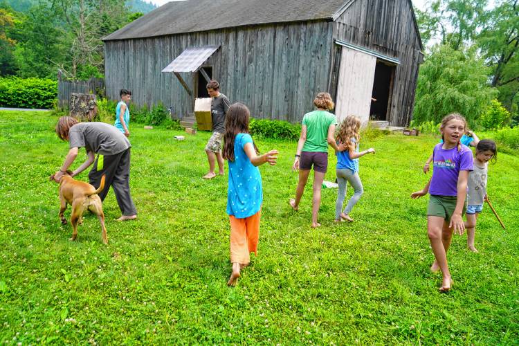 Children play outside Piti Theatre Co.’s barn on Avery Brook Road in Charlemont.