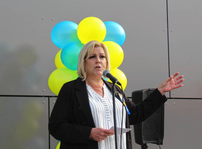 Tammi Cadieux, manager of the Orange Walmart Supercenter, speaks at a ceremony celebrating its remodel on Friday morning.