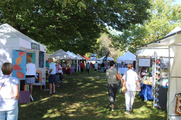 Attendees peruse wares at the Old Deerfield Fall Arts and Crafts Festival in 2021. The 48th annual event returns on Saturday, Sept. 21, and Sunday, Sept. 22.