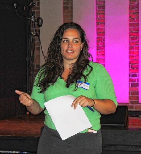 Amanda Sanderson, executive director of the New England Learning Center for Women in Transition (NELCWIT), addresses attendees of a summit for area nonprofits held at Hawks & Reed Performing Arts Center’s Grand Ballroom on Tuesday afternoon. The summit focused on efforts to enhance the services provided to the community and how the organizations can approach operations more strategically.