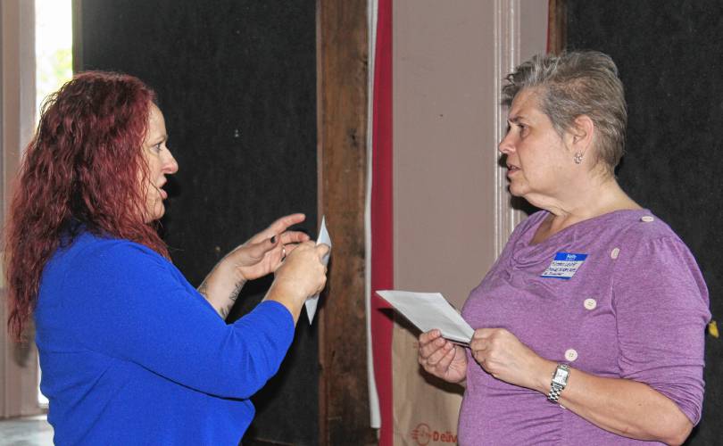 Kena Vescovi, executive director of Valuing Our Children in Athol, and Kirsten Levitt, executive director and chef at Stone Soup Café in Greenfield, chat during a summit for area nonprofits held at Hawks & Reed Performing Arts Center’s Grand Ballroom on Tuesday afternoon. The summit focused on efforts to enhance the services provided to the community and how the organizations can approach operations more strategically.