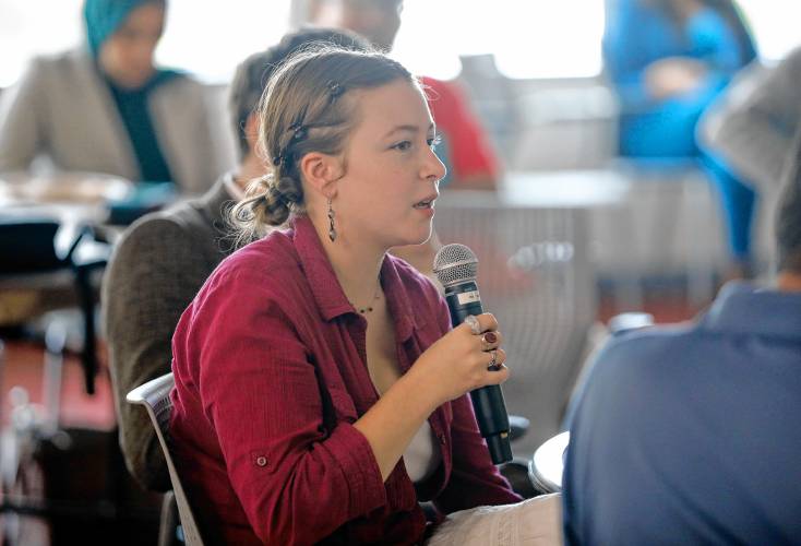 Beatrice Rogers, a third-year psychology and holistic health major, directs a question during Tuesday’s forum at the University of Massachusetts Amherst.