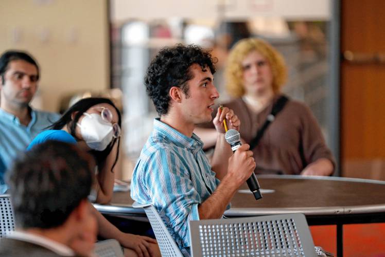 Liam Rue directs a question to the panel during a forum hosted by the Public Higher Education Network of Massachusetts and the UMass Amherst Student Government Association to discuss the Debt Free Future Act with legislators on Tuesday at the University of Massachusetts Amherst.