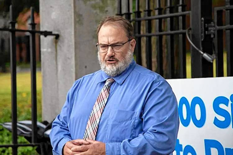 Gun Owners Action League Executive Director Jim Wallace speaks at a press conference outside the State House on Sept. 19.