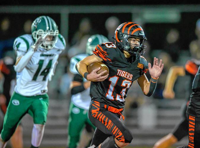 South Hadley’s Noah Hambley, right, carries the ball past Greenfield’s Erik Martineau during the first half at South Hadley on Friday.