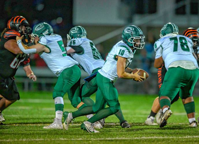 Greenfield’s Mason Cummings prepares to hand off the football against South Hadley during the first half at South Hadley on Friday.