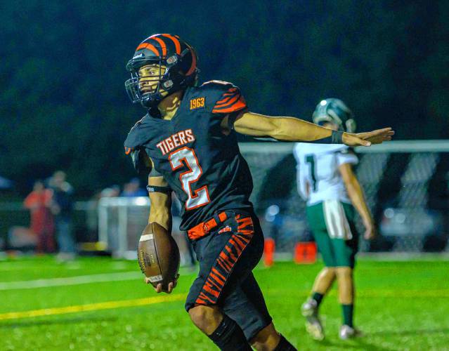 South Hadley’s Julius Hebenth, left, celebrates a first half touchdown against Greenfield on Friday.