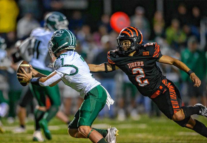 Greenfield’s Caleb Murray, left, is pressured by South Hadley’s Julius Hebenth during the first half at South Hadley on Friday.