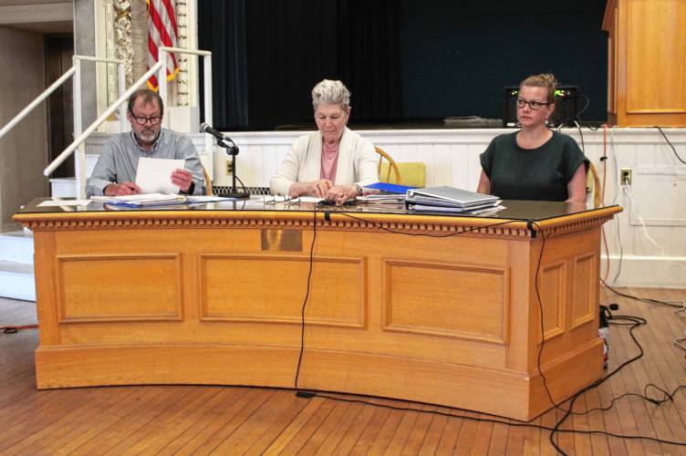 Orange Mobile Rent Control Board member Andrew Smith, Chair Jane Peirce and member Julie Davis at a public hearing in Orange Town Hall on Tuesday. They voted to increase Leisure Woods Estates’ $398 monthly fees by about $52 for one year starting Dec. 1 and by an additional $50 beginning Dec. 1, 2025.