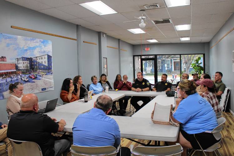 Greenfield Police officers discuss downtown safety with members of the Greenfield Business Association at its Tuesday night roundtable.