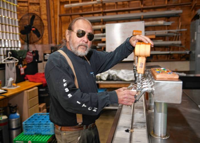 Co-founder and President Gary Bogoff pours a fresh Oktoberfest beer at Berkshire Brewing Co. in South Deerfield.