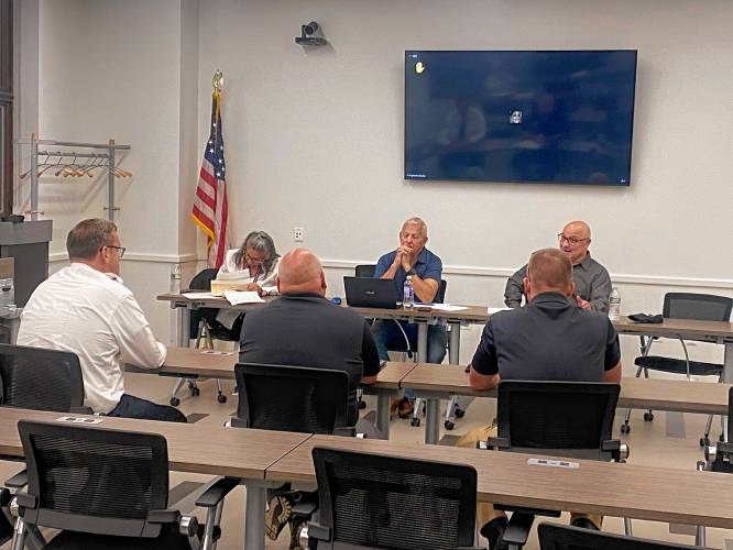 Members of the Greenfield Public Safety Commission discuss expansion of the city’s reverse 911 system after a foot pursuit earlier this month.