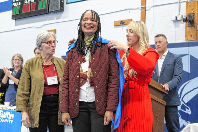 Twice As Smart Director Gloria Matlock was honored at the Franklin County Chamber of Commerce’s “Super Chamber Breakfast” on Friday at Franklin County Technical School. Twice As Smart board member Deborah Shriver and Chamber Executive Director Jessye Deane were on hand to provide Matlock with a cape.