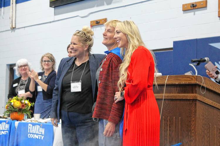 Franklin County Sheriff’s Office Regional Dog Shelter Director Leslee Colucci, center, was honored at the Franklin County Chamber of Commerce’s “Super Chamber Breakfast” on Friday at Franklin County Technical School.