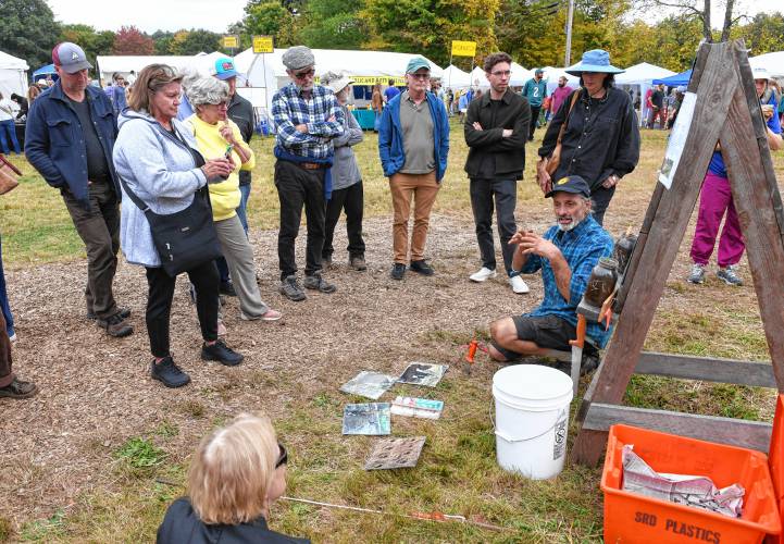 Ricky Baruc of Seeds of Solidarity Farm leads a garlic-growing seminar at the North Quabbin Garlic and Arts Festival in Orange on Sunday afternoon. 