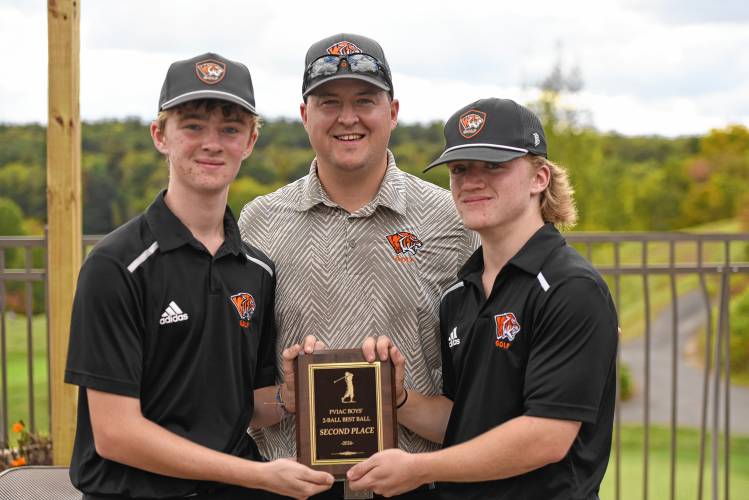 South Hadley’s duo of Ryan MacGregor (left) and Caiden Drohan (right) with head coach Jason Borque (middle) after the two captured second place with a round of 68 at the PVIAC Boys Golf Two-Ball Invitational at Cold Spring Country Club in Belchertown on Monday afternoon.