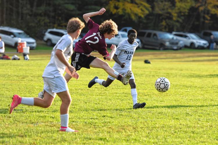 Easthampton’s Liam Scott-Smith (12) leaps while firing a shot on goal during the second half of the Eagles’ 2-0 win over Mahar on Wednesday afternoon at Nonotuck Park.