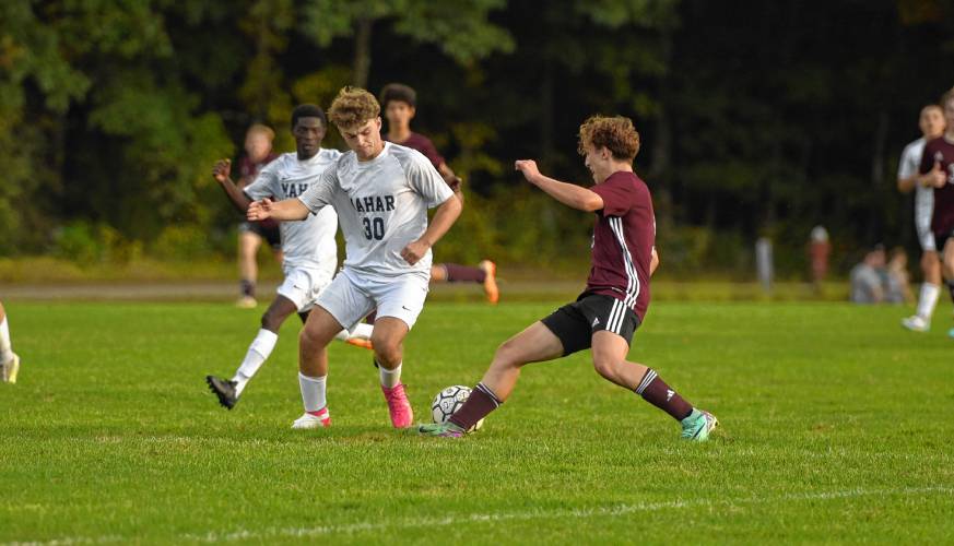 Easthampton’s Brayden O’Connor (right) takes a touch around Mahar’s Jackson Burham during the second half of the Eagles’ 2-0 win over the Senators on Wednesday afternoon at Nonotuck Park.