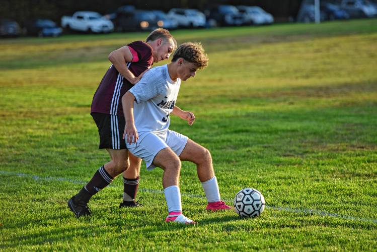 Mahar’s Jackson Burham (30) shields an oncoming Easthampton defender during the second half of the Senators’ 2-0 loss on Wednesday afternoon at Nonotuck Park.