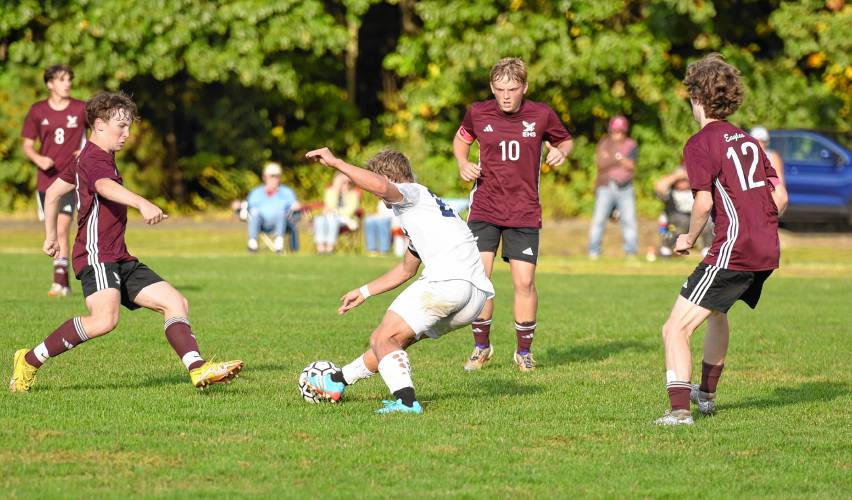 Mahar’s Mathieu Soucy maneuvers through a trio of Easthampton defenders during the first half of the Senators’ 2-0 loss on Wednesday afternoon at Nonotuck Park.