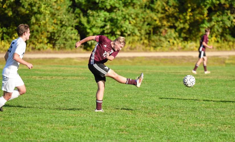 Easthampton’s Ethan Mullaly sends a through ball up to his forwards during the first half of the Eagles’ 2-0 win over Mahar on Wednesday afternoon at Nonotuck Park.