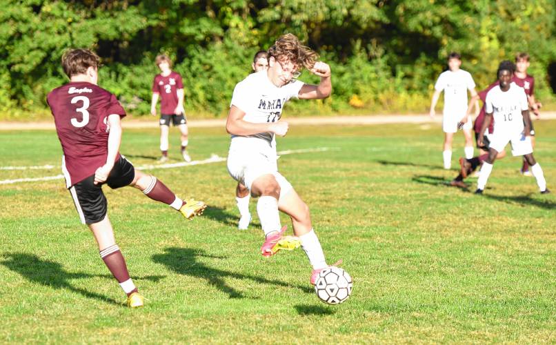 Mahar’s Coltin Fausett (17) throws his body in front of Easthampton forward Sean Hopkins’ shot attempt during the first half of the Senators’ 2-0 loss on Wednesday afternoon at Nonotuck Park.