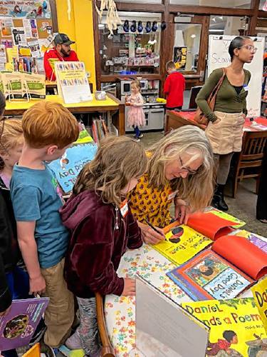 Families were welcomed to the Sunderland Public Library Tuesday afternoon to meet Leverett-based author and illustrator Micha Archer and celebrate Title I grant funding for the district, which provides extra support to a select group of students with learning goals — in Union 38’s case, reading goals.