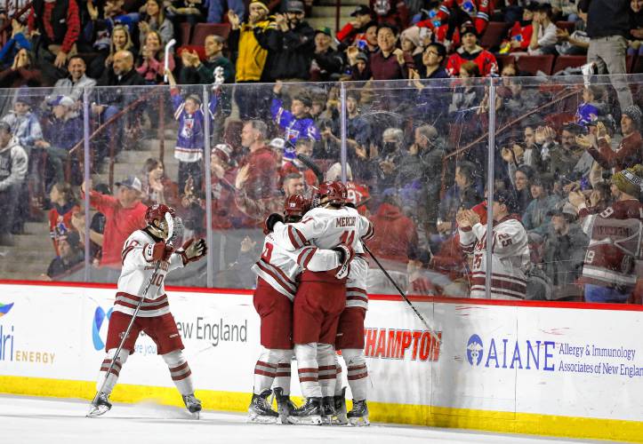 UMass players celebrate a second period goal against Boston College last season at the Mullins Center.