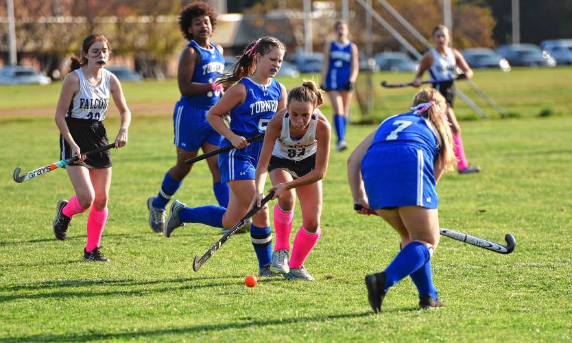 Smith Academy’s Sophia Jagodzinski (32) dribbles through a pack of Turners Falls defenders during the first half of the Falcons’ 2-1 win on Thursday afternoon in Hatfield.