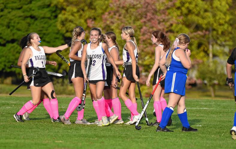 The Smith Academy field hockey team celebrates Bella Gavron’s go-ahead goal with under two minutes remaining in the fourth quarter. The Falcons defeated Turners Falls 2-1 on Thursday afternoon in Hatfield.