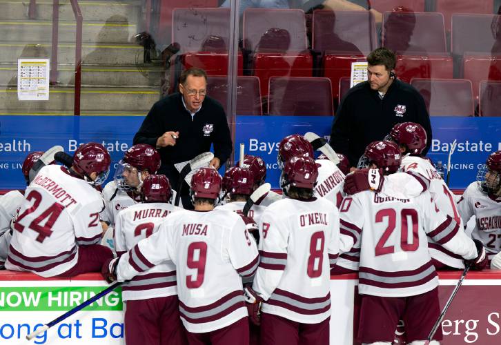 UMass head coach Greg Carvel talks with his team in the first period against AIC last year at the Mullins Center in Amherst.