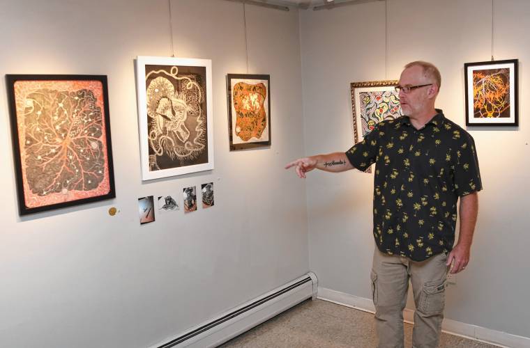 Tim Gorts with his exhibit, “Its Never Too Late To Create,” at the Artspace Community Arts Center on Mill Street in Greenfield. The exhibit is on vie