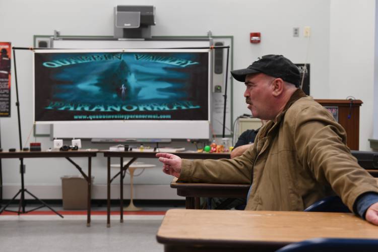 Steven Maggiolino, of Easthampton, relates a story during a Quabbin Valley Paranormal meeting at the Orange Fire Department’s secondary station on Mill Yard Road.