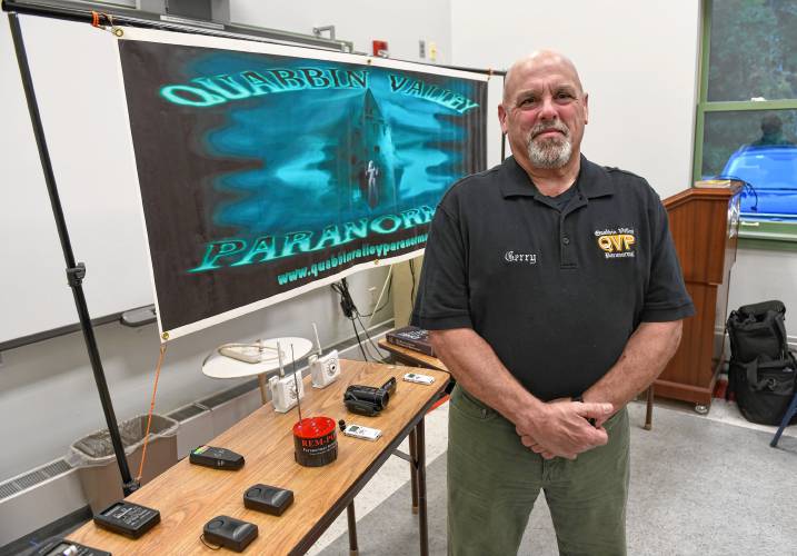 Quabbin Valley Paranormal founder Gerry Powling, of Orange, with some of the devices the group uses to detect sound and movement.