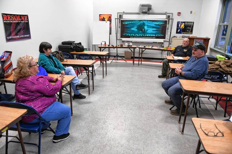 Members of Quabbin Valley Paranormal tell stories of paranormal activity during a meeting at the Orange Fire Department’s secondary station on Mill Yard Road.